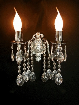 Wall light with solid metal base and real crystals.