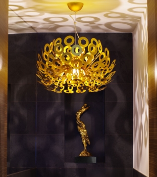 Golden dancing act sculpture