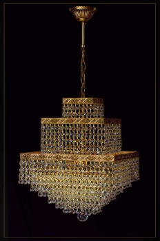 Oriental cube gold chandelier with ornamentation and 4 illuminates.