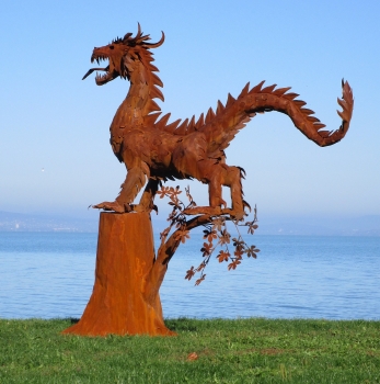 Amazing dragon sculpture rusty iron on tree