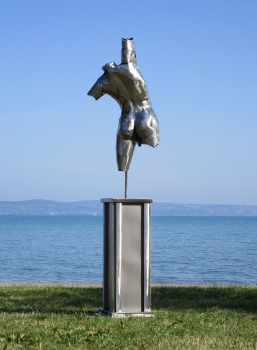 Man artwork torso on column