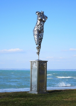 Act sculpture on pillar stainless steel