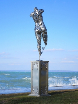 Large female act garden sculpture on pillar