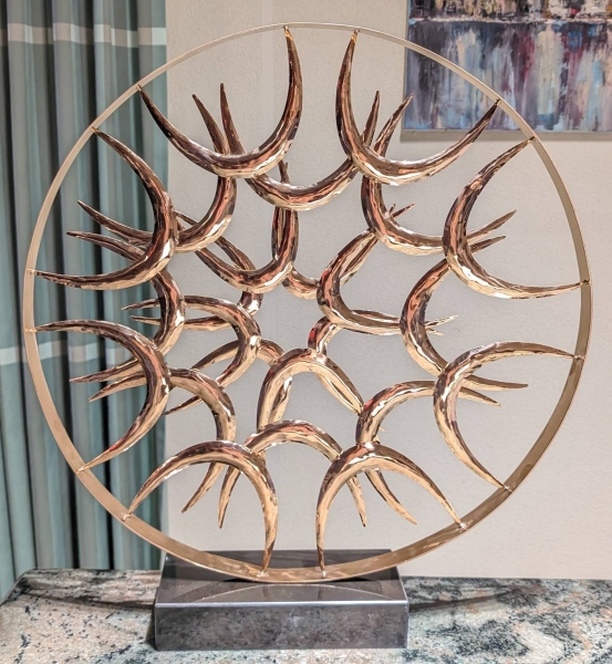 Circular sculpture red gold
