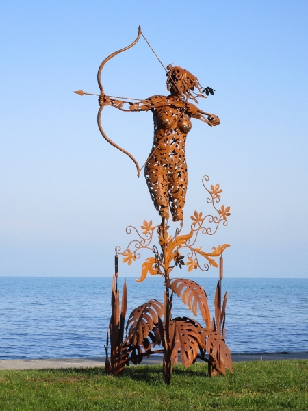 Life size Artemis sculpture rusty in wildlife