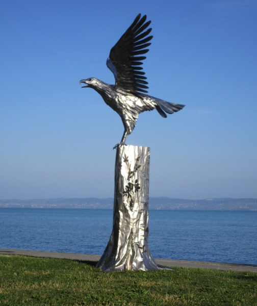 Steel sculpture eagle on tree