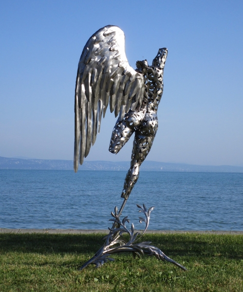 Iron angel with wing garden sculpture