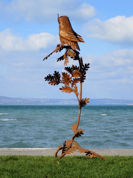 Owl on branch sculpture