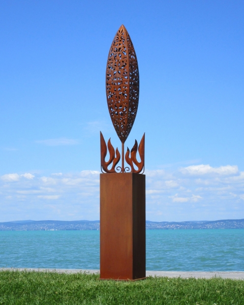 Big stainless steel artwork on rusty column