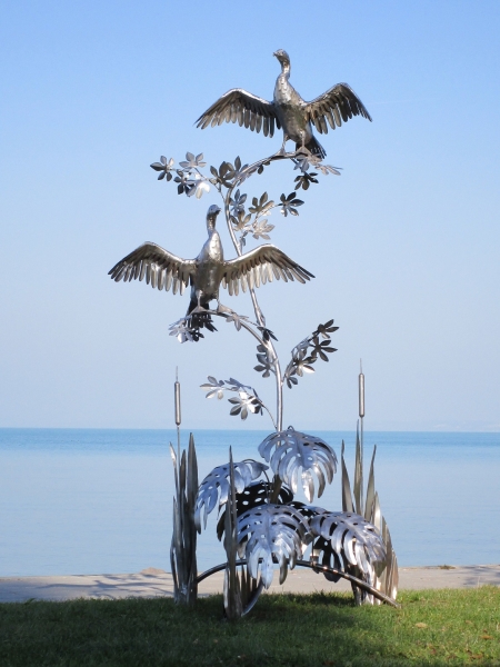 Cormorant couple garden sculpture made in stainless steel height 270 cm.