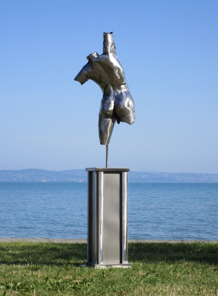 Man artwork torso on column