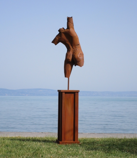 Torso on column rusty iron