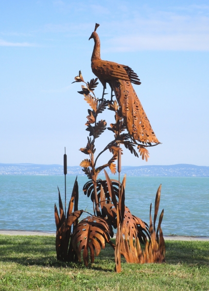 Peacock on tree garden sculpture